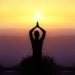 practising yoga at sunrisse
